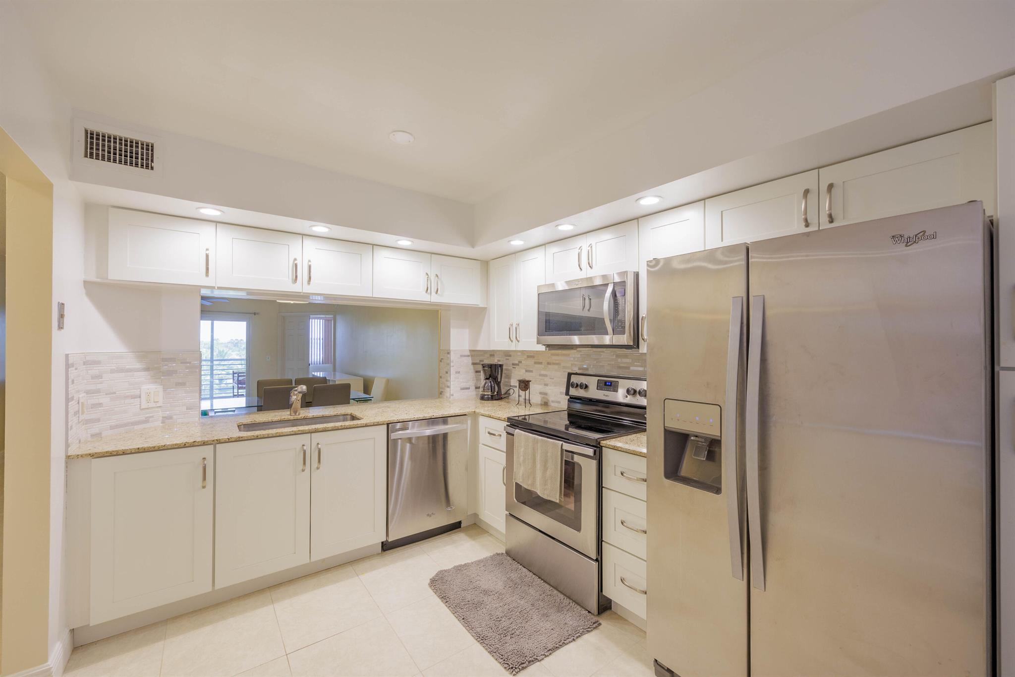 Enjoy expansive canal views from your private screened balcony. This spacious unit features a full-size washer and dryer in a dedicated laundry room, a cozy eat-in kitchen, and generously sized bedrooms. The primary suite includes a large walk-in closet for added convenience. Residents have access to a vibrant clubhouse offering a fitness center, live entertainment, social clubs, educational classes, shuttle transportation, and more (golf, pool, jacuzzi, tennis, racquet ball, theater, shows, concerts, dances, Saunas, BBQ areas.
