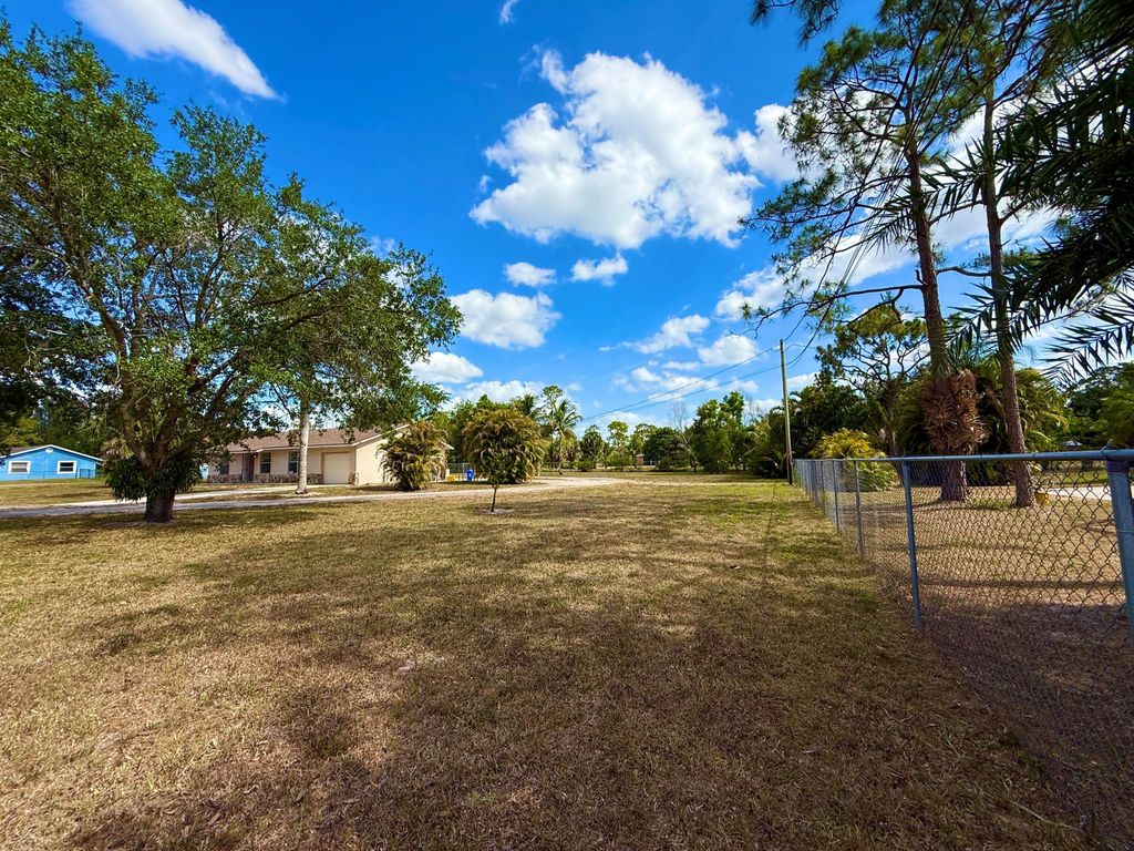 Photo of 16394 Pimlico Drive E, Loxahatchee Groves, FL 33470 (MLS # R11087644)