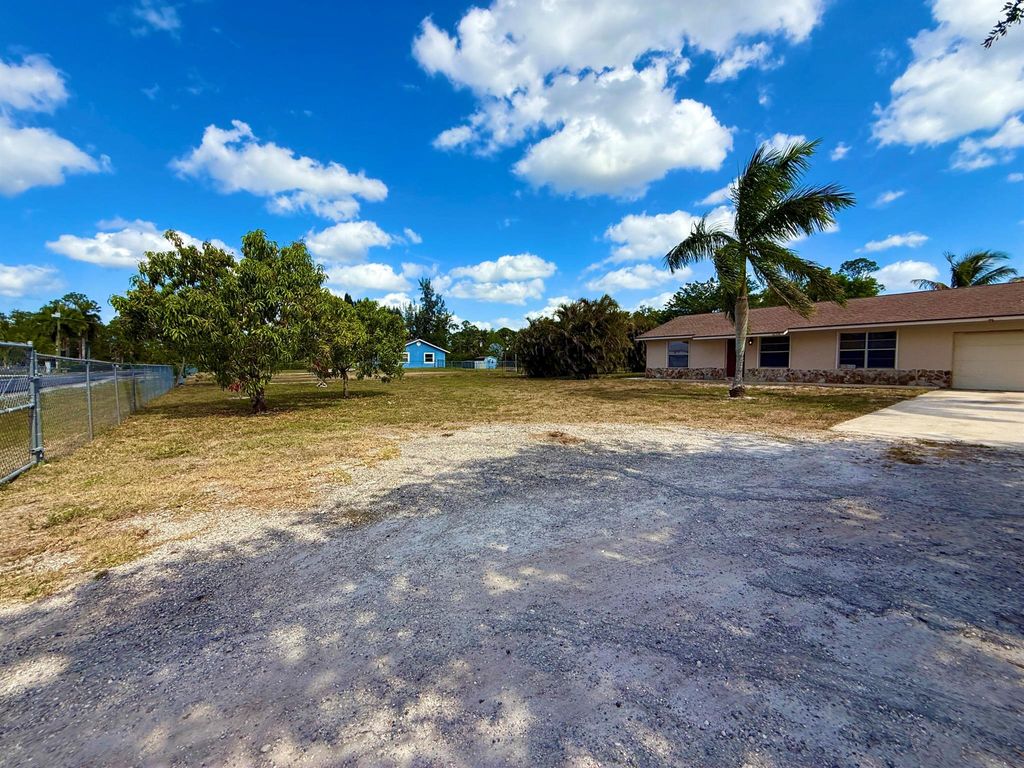 Photo of 16394 Pimlico Drive E, Loxahatchee Groves, FL 33470 (MLS # R11087644)