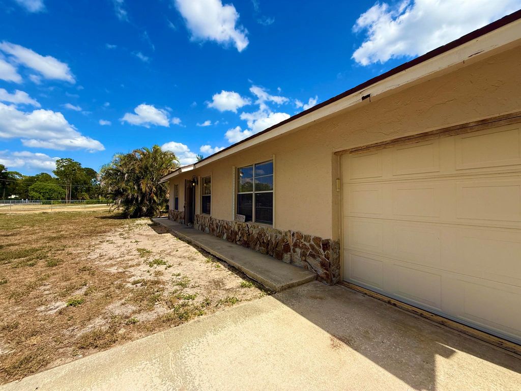 Photo of 16394 Pimlico Drive E, Loxahatchee Groves, FL 33470 (MLS # R11087644)