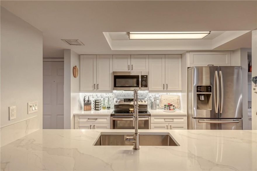 RARE find! Magnificent renovated Private End unit Villa! Home features great outdoor views 2 bedroom and 2 bathrooms! this is a pet friendly community. Freshly painted , newer appliances, and tile throughout. Designated carport right outside your front door. Kitchen snack bar, Led Lighting, full size washer and dryer and more. Gated community with club house and pool. Community has lots of green space, wild life , heated pool and lush landscaping. In the heart of Boynton beach Convenient to I95 and Turnpike. Turn-Key move in ready!