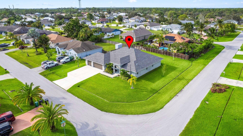 Photo of 2001 SW Grant Avenue, Port Saint Lucie, FL 34953 (MLS # R11029959)