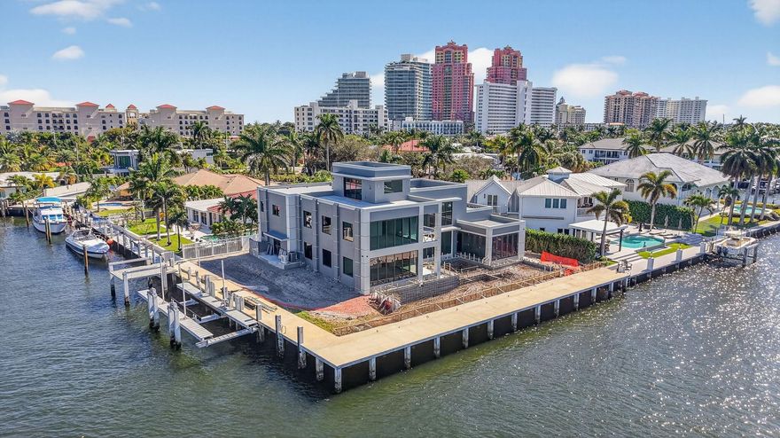 A rare & valuable find for both boaters & beach-lovers with close proximity to Fort Lauderdale beach! Located in quiet & fast-changing beachside community close to shopping & dining. Brand-new custom PRIME POINT offers the ultimate SoFlo luxury lifestyle, over 200ft of waterfront, stunning open intracoastal views on the newly regulated no-wake zone. Direct intracoastal (108ft), wide side canal (96ft), 27,000lb boatlift. Designed for entertaining, 3 levels include open Chef's kitchen & living room, separate bar area, all capturing endless waterway views & custom resort-style pool area with Summer kitchen. Significant VIP suite 1st level, plus expansive second level primary suite with private balcony, stairs to roof terrace. Completion Spring 2026. Professional interiors by Jaime Blomquis