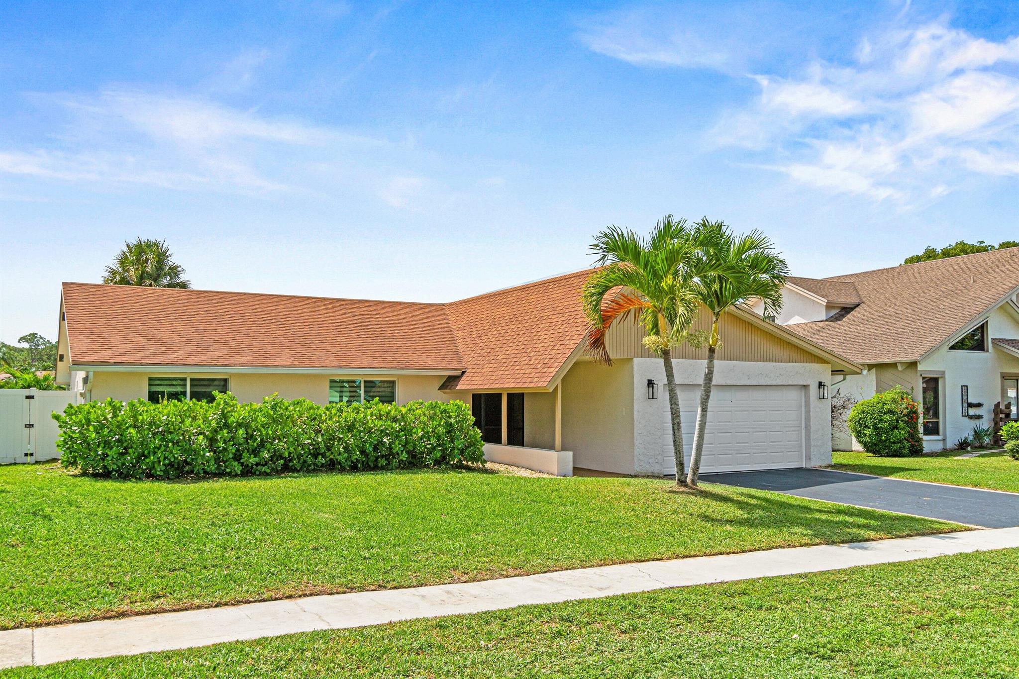 Nestled within the highly desirable Cimarron community of Loggers' Run in Boca Raton, this exquisite renovated single-family residence features, full Impact windows throughout, three bedrooms, two bathrooms, a spacious two-car garage, a private garden including an oversized pool, a separate screened-in covered patio, newly planted palm trees surrounding the garden and pool area with newly installed artificial grass and fence for complete privacy and easy maintenance.
