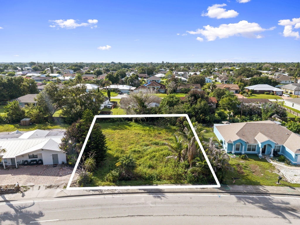 Photo of 158 NE SAINT JAMES DR, Port Saint Lucie, FL 34983 (MLS # B26070543)