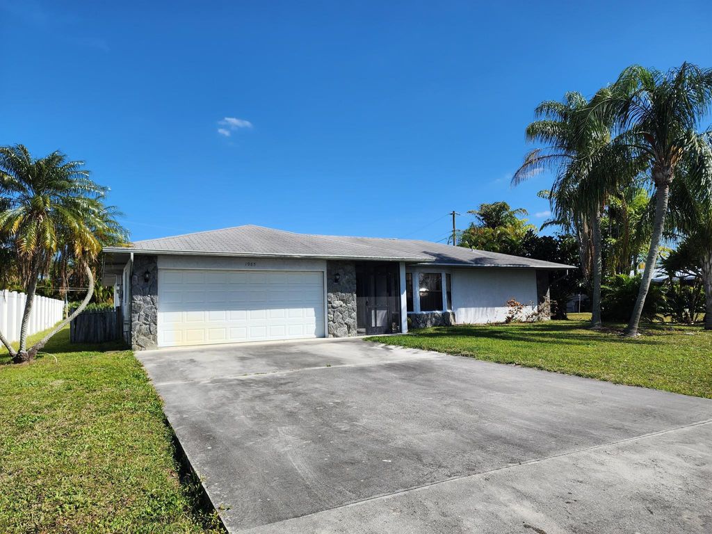 Photo of 1985 SE Dupont Street, Port Saint Lucie, FL 34952 (MLS # R10964460)