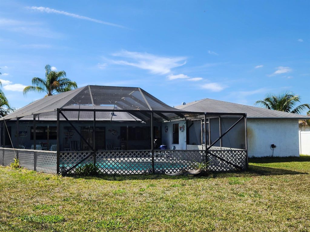 Photo of 1985 SE Dupont Street, Port Saint Lucie, FL 34952 (MLS # R10964460)