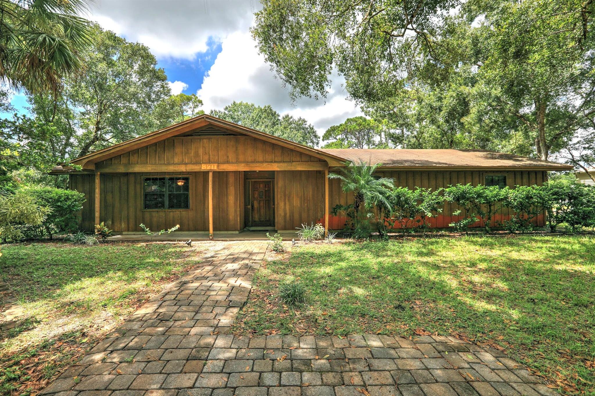 This spacious three-bedroom, two-bath home sits on over an acre in Vero Lake Estates, offering endless potential forexpansion, outdoor living, and all your recreational needs. Nestled on a beautiful street, this property is a rareopportunity--just bring your vision and a little TLC to make it truly remarkable!