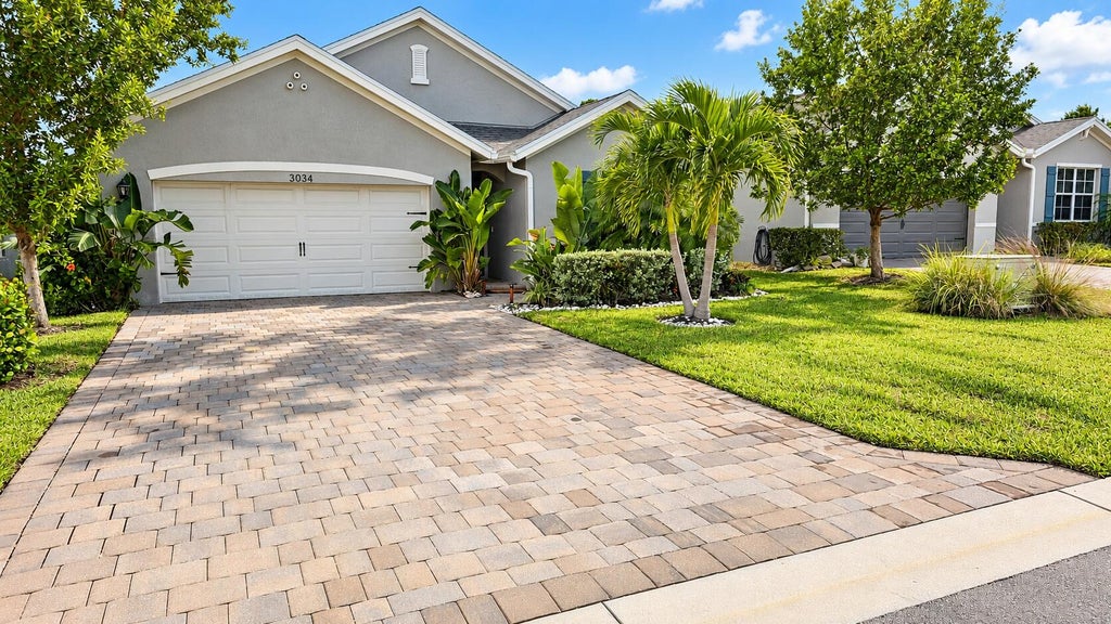 Photo of 3034 NE Skyview Lane, Jensen Beach, FL 34957 (MLS # B26027148)