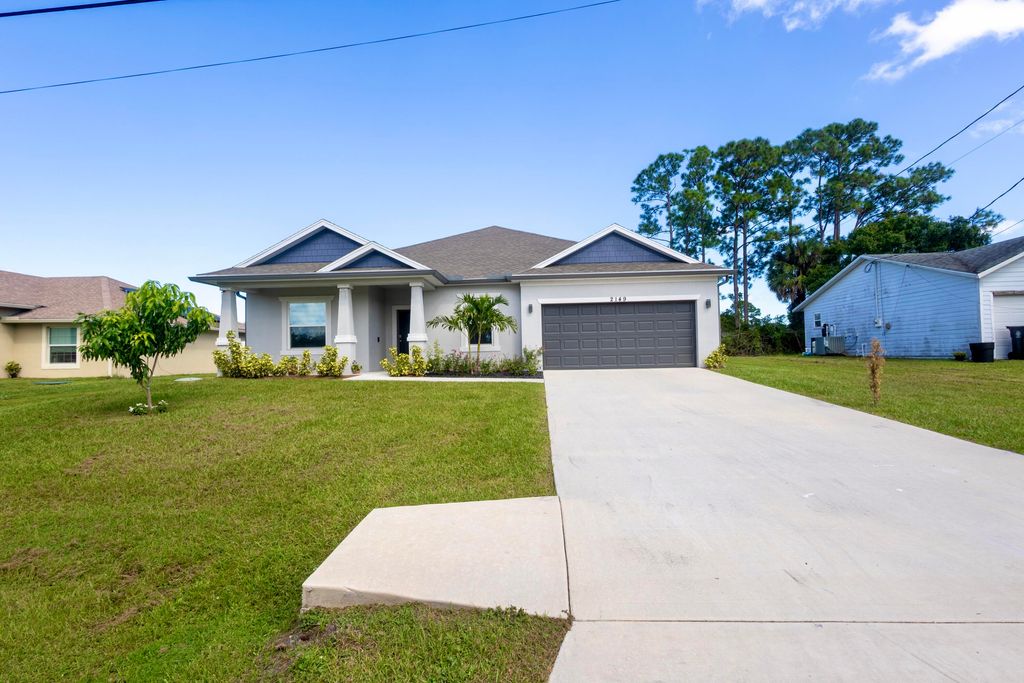 Photo of 2149 SW Susset Lane, Port Saint Lucie, FL 34953 (MLS # B26009241)