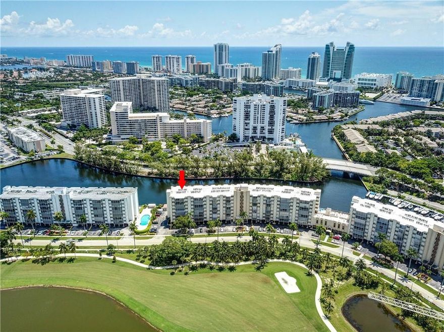 The moment you enter this beautiful, spacious, and furnished 2/2 corner unit, you will not want to leave. It has amazing views of the redesigned Diplomat golf course and a large open floor plan with a capacious screened balcony which makes a perfect setting for entertaining guests. It has a wide gourmet kitchen which offers recessed lighting, granite countertops/back splash, stainless steel appliances, and a dual wine cooler. Tastefully updated baths with granite countertops and plenty of closets throughout. The covered parking space is directly under the unit and personal storage located on the first floor large enough for bikes, beach chairs & more. Amenities include heated pools, fitness center, BBQ gas grills, and more. Great location! Short walk to shopping, restaurants, beach & more!