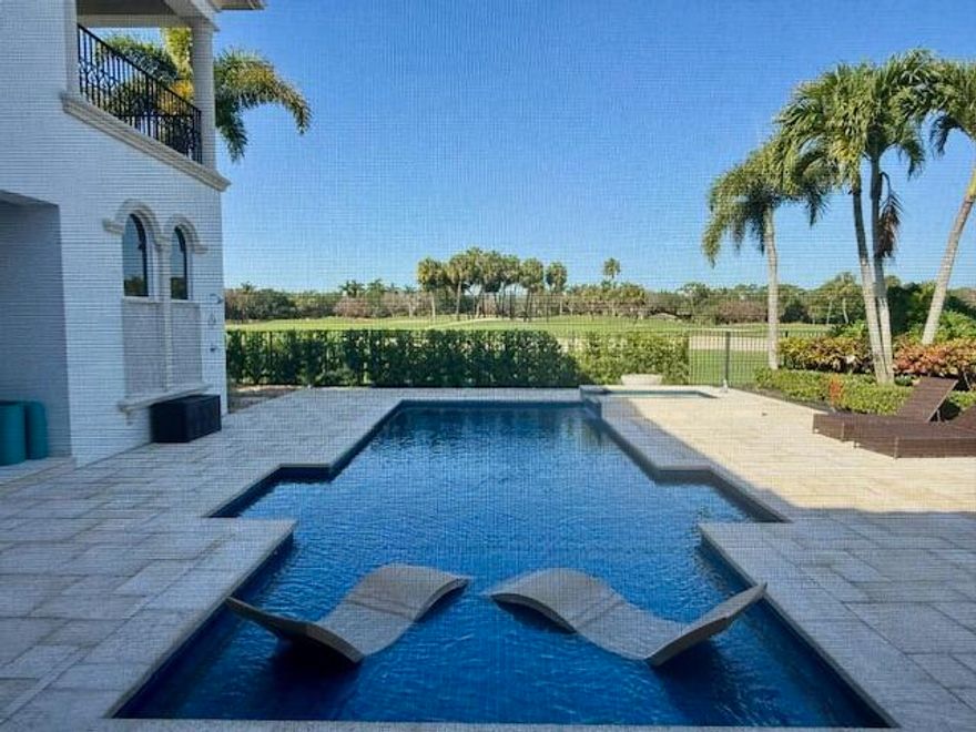 Stunning estate home with spectacular golf course views, ideally situated within the prestigious Golf Estates of Old Palm Golf Club. This meticulously renovated two-story residence offers 4 bedrooms plus a private office, 4 full bathrooms, and 2 half baths—including an elegant powder room—across more than 5,500 square feet of refined living space. Designed for both comfort and sophistication, the home features a 3-car garage, private elevator, whole-house generator, newer roof (2023), several newer A/C systems, and full impact windows and doors. Upon entry, this sophisticated residence exudes timeless elegance with marble flooring and refined architectural details throughout. The expansive gourmet kitchen is a true centerpiece, featuring a large separate island, dual sinks,  and an array of custom cabinetry, complemented by premium appliances including a Sub-Zero refrigerator and Viking appliances. The kitchen flows seamlessly into formal living and dining spaces ideal for entertaining. Custom built-ins and thoughtfully curated finishes elevate every room, while the renovated and reimagined guest bedrooms provide stylish and comfortable accommodations. An extensive security system, including high-definition video cameras, offers added peace of mind. The outdoor living experience is equally impressive, showcasing a resort-style pool and spa enhanced by a new travertine pool deck, new pool heater, and salt cell system, along with a fully equipped summer kitchen. The space is surrounded by lush, professionally landscaped grounds that create a private and serene setting overlooking the golf course.  A must-see to truly appreciate the remarkable updates, craftsmanship, and breathtaking views this home has to offer.
