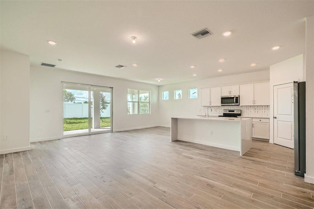 Photo of 1936 NE Ocean Dunes Drive, Jensen Beach, FL 34957 (MLS # R10907264)