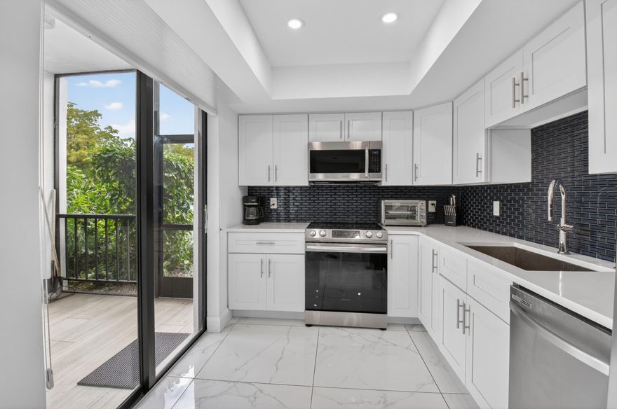 Welcome to Boca West Country Club and this fully renovated 2-bedroom, 2-bathroom ground-floor condo offering approximately 1,250 square feet of stylish living space. Beautifully updated with a new kitchen, new bathrooms, 24x24 porcelain flooring, and more, this move-in-ready residence combines modern finishes with everyday comfort. The private entrance and parking directly outside your front door make this home feel especially convenient and private, with no need to enter through the main building. Enjoy the best of Boca West living with world-class golf, tennis, fitness, dining, spa, and all the unmatched amenities of this award-winning country club community.