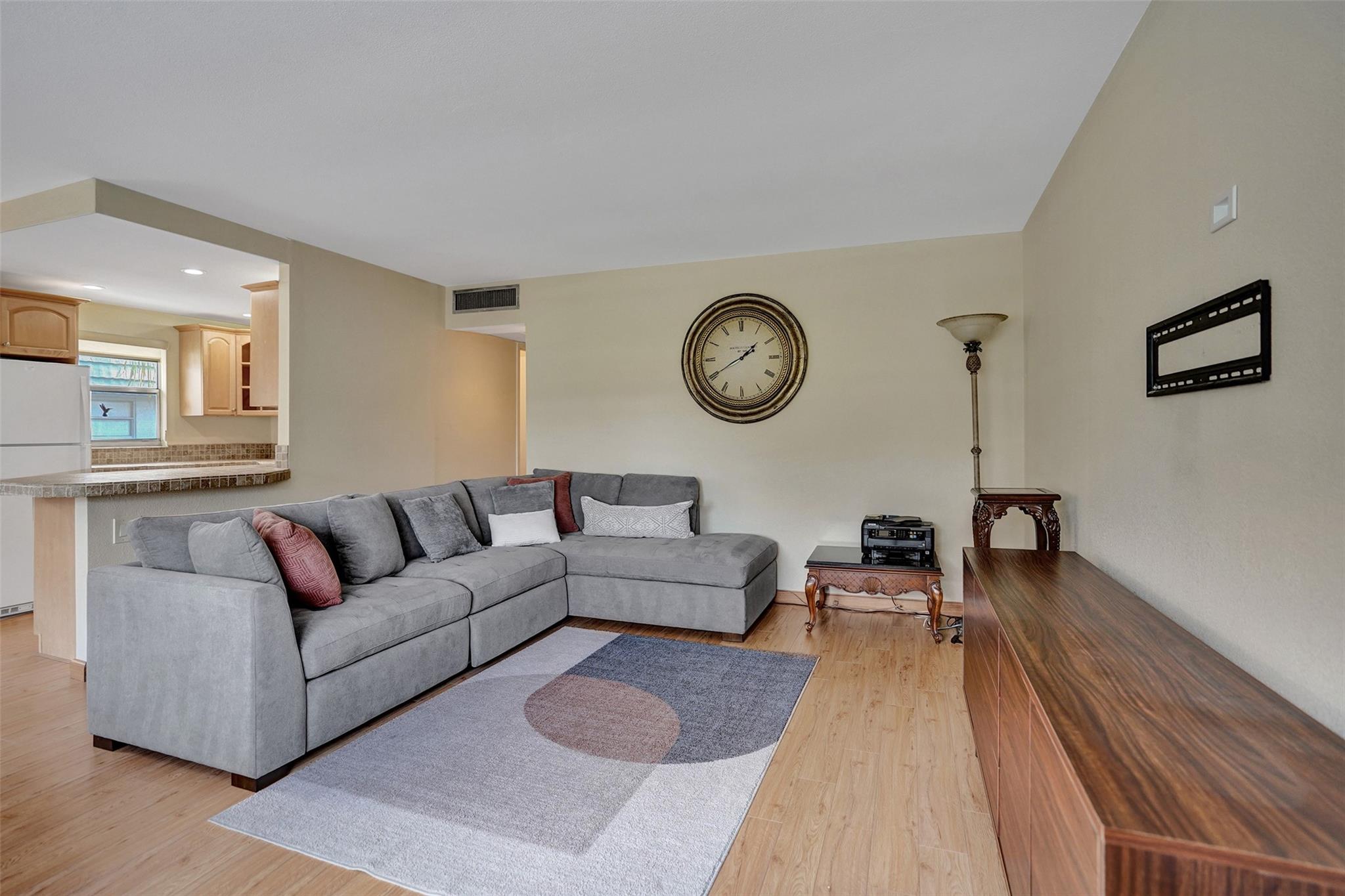 Discover this tastefully updated 2-Bed/2-Bath in the sought-after Kings Point 55+ community. Complete with a private screened back patio with a washer and dryer. This unit is located on the 2nd Floor with secure elevator access. Enjoy a bright open layout with a newer kitchen featuring extra cabinetry, tumble stone countertops, countertop seating, and updated appliances. Both bathrooms have been redone with granite countertops. Very large walk-in closet in the primary bedroom. Kings Point offers world-class amenities, including golf, tennis, pools, a large clubhouse, fitness facilities, a theater, and a courtesy bus. Located on a quiet side of the community close to shopping, dining, and beaches. **CAN PURCHASE FURNISHED**