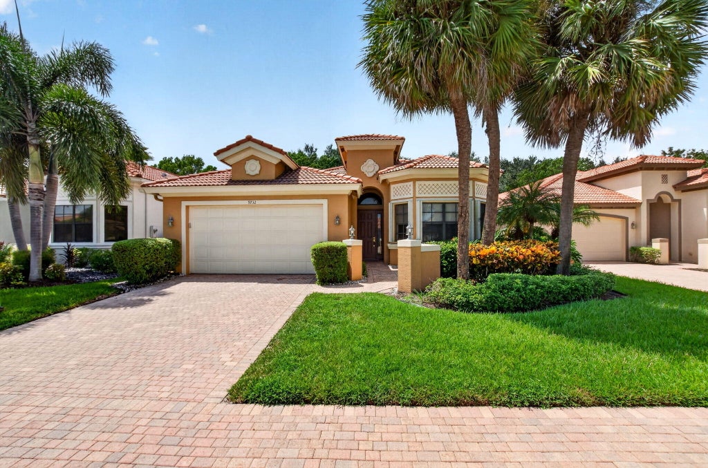 Photo of 9732 Isles Cay Drive, Delray Beach, FL 33446 (MLS # B26077234)