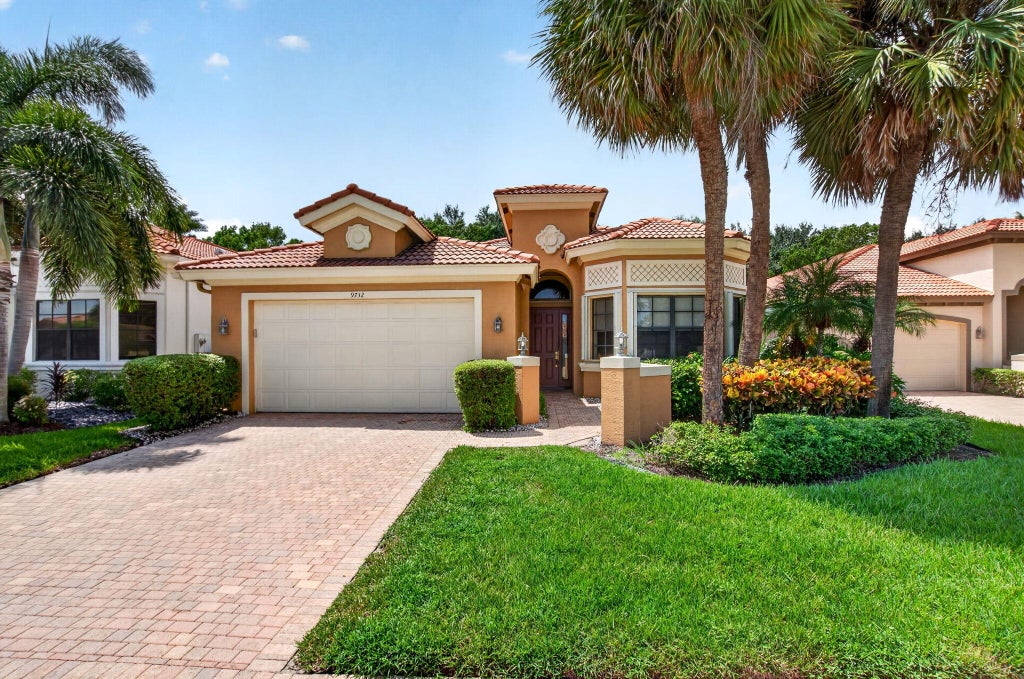 Photo of 9732 Isles Cay Drive, Delray Beach, FL 33446 (MLS # B26077234)