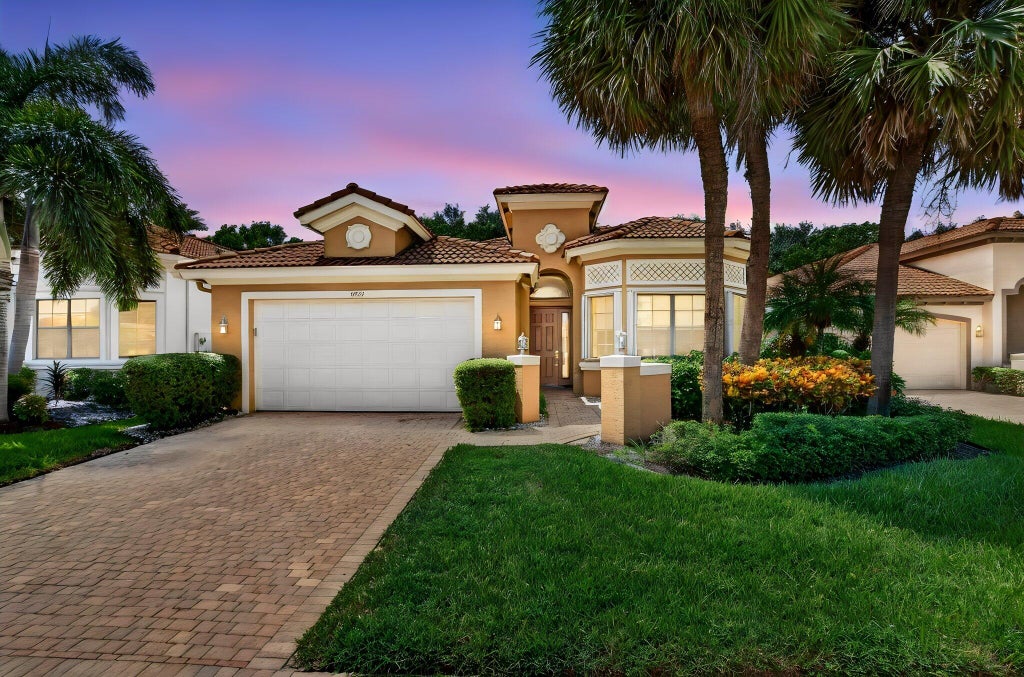 Photo of 9732 Isles Cay Drive, Delray Beach, FL 33446 (MLS # B26077234)