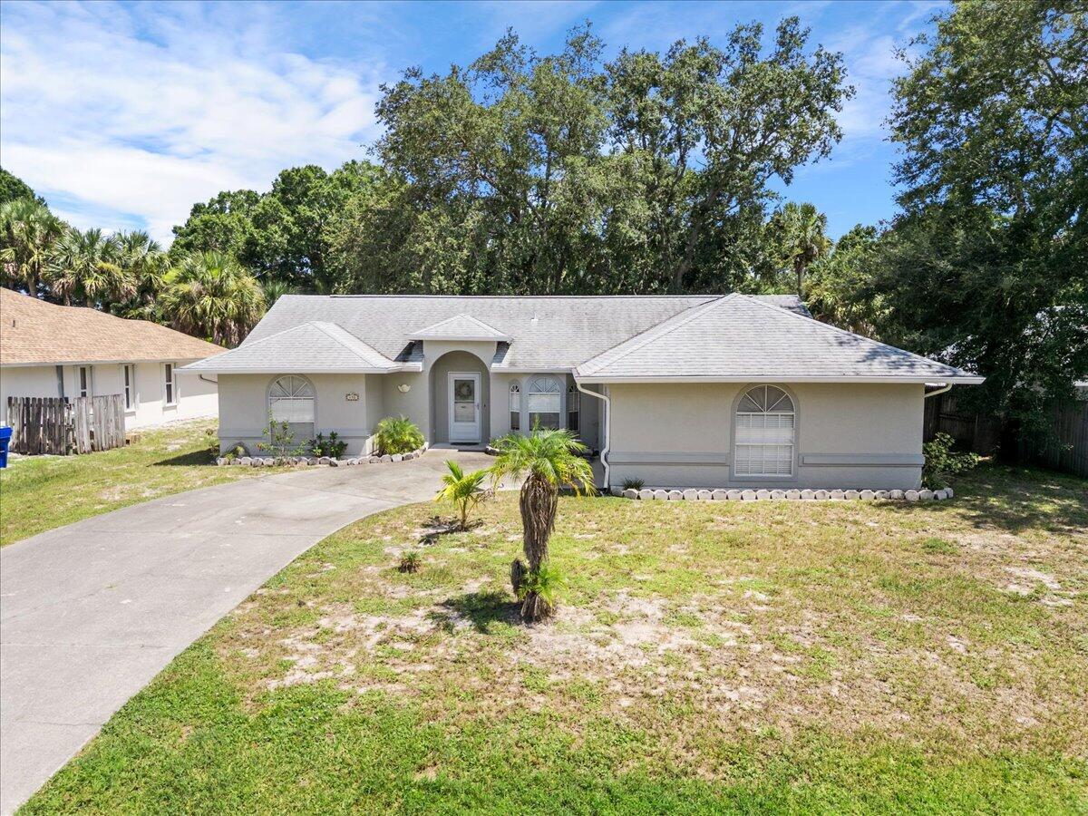 Discover your next home in Sebastian Highlands! This peaceful, safe neighborhood offers easy access to I-95, top-rated schools, parks, shops, restaurants, nature trails, and stunning beaches. Inside, you'll enjoy new laminate flooring and tile, vaulted ceilings, and stainless steel appliances. The master bedroom is spacious and private, with generously sized guest rooms. A 2021 roof and 2016 HVAC offer peace of mind. Sitting on a 1/4 acre lot with a generously sized driveway, there is plenty of room for your boat, RV, or ATVs! NO HOA. The private backyard with a comfortable covered patio provides a serene retreat. With a little TLC, this house will truly shine!