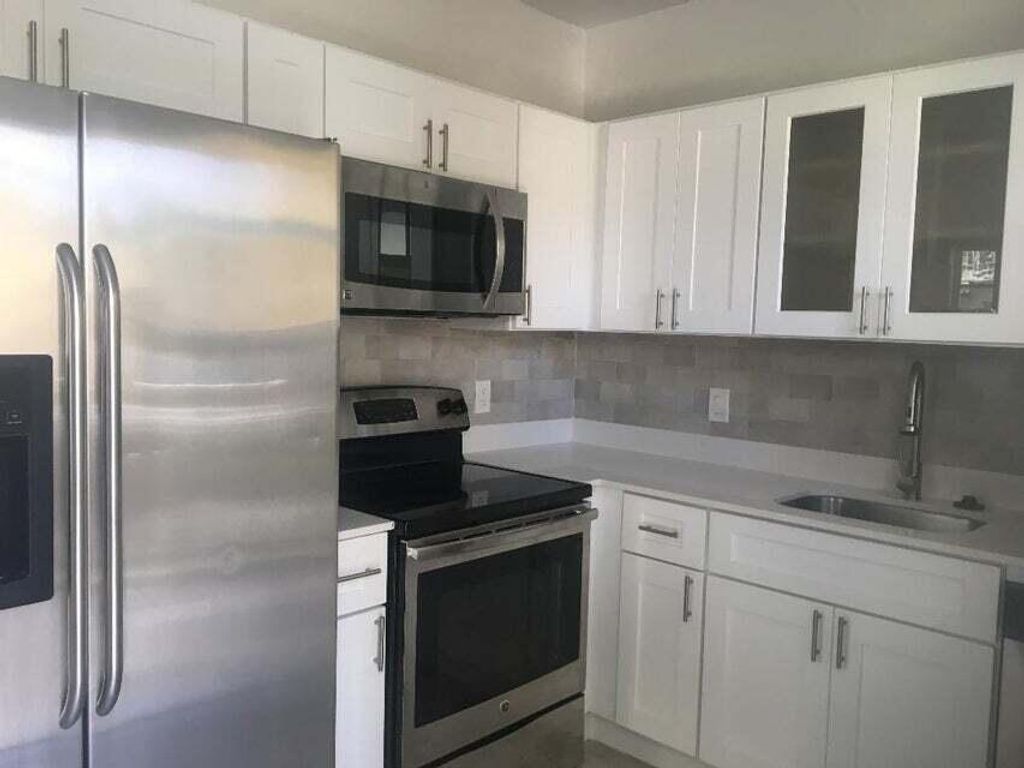 Photo of 407 S Lakeside Drive #A, Lake Worth Beach, FL 33460 (MLS # R11044087)