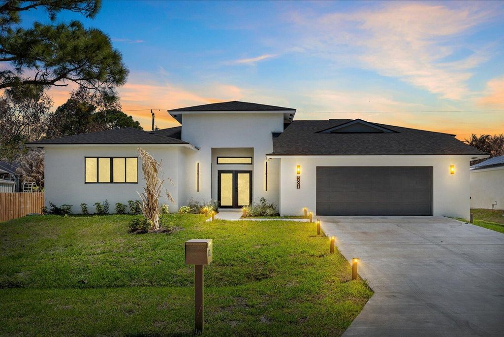 Photo of 5691 NW North Macedo Blvd, Port Saint Lucie, FL 34983 (MLS # B26001122)