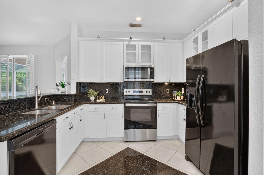 Photo of 11371 SEA GRASS Circle, Boca Raton, FL 33498 (MLS # B26089632)