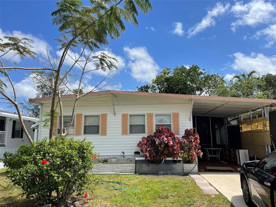 Beautiful 2/2 double wide with carport - shed - screened in patio plus open deck overlooking canal - -nice laminate floors - big back yard - -assoc. states it is HOPA verified - priced right for quick sale - -truly a must see.......