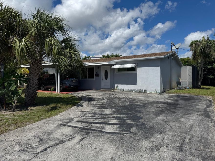 Beautifully remodeled 3-bedroom, 2-bath pool home located in desirable North Andrews Gardens. This cozy home features all impact windows, doors, and sliding door. Remodeled kitchen with wood cabinets, granite countertops, and stainless steel appliances. Both bathrooms have been recently remodeled; second bathroom offers convenient access to the pool area. Tile floors throughout. Interior laundry/utility room for added convenience. Private fenced backyard with pavered pool deck, perfect for entertaining. Roof replaced in 2017. Cast iron pipes under ground were replaced approximately 5 years ago for kitchen and baths . Water heater is about 4 years old. Located on a quiet street close to shopping, dining, gym, train station, and movie theater. Move-in ready and well maintained!