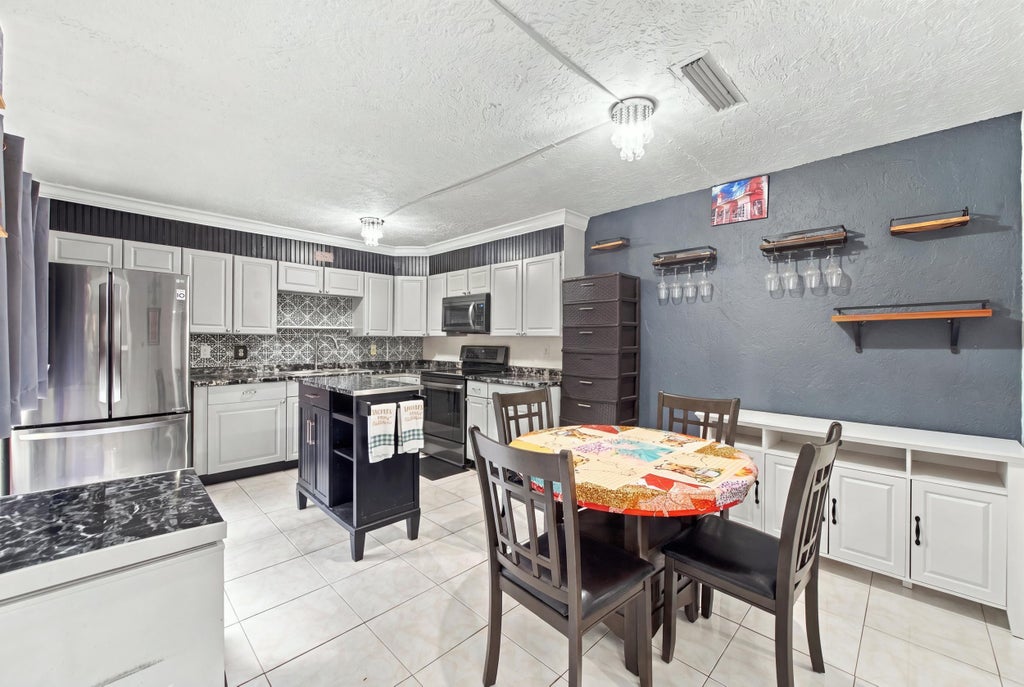 Photo of 2483 Waterside Drive, Lake Worth, FL 33461 (MLS # B26093070)