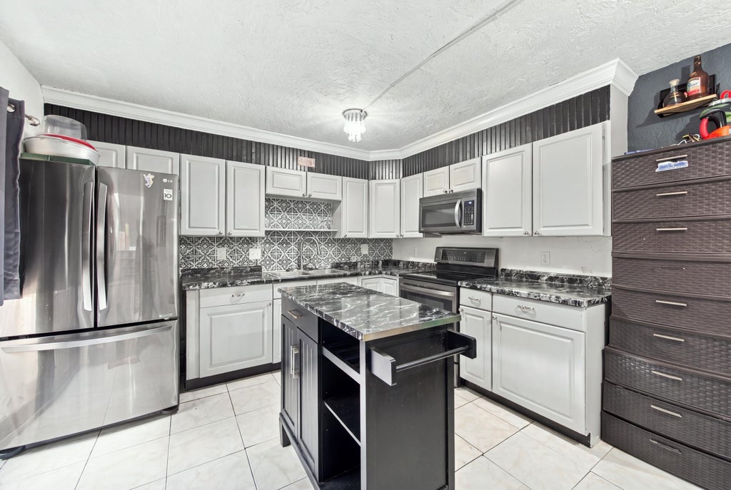 Photo of 2483 Waterside Drive, Lake Worth, FL 33461 (MLS # B26093070)