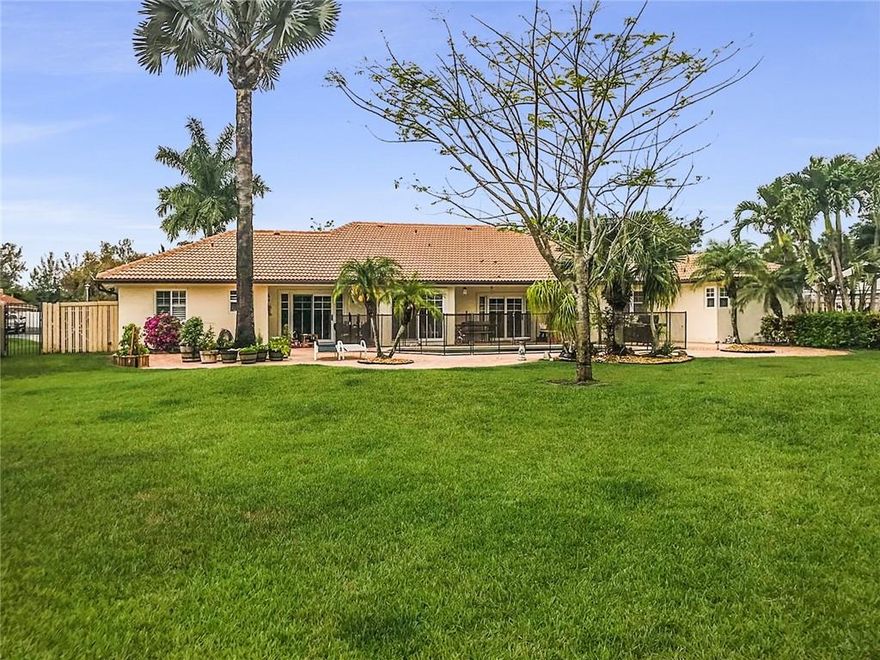 Gorgeous, Updated Family Retreat in the Desirable Loggers Run Area of Boca Raton. A+ Schools! Almost 3000 SF 4-Bedroom, 3-Bath Home with Very Large Rooms Situated on a 2/3 of an Acre Lot! 2.5 Car Garage. HUGE Fenced-in Private Backyard with a Tropical Pool Area & ENORMOUS Patio. Yard is Organically Treated! Split Bedroom Plan. Master Suite Boasts a Jetted Tub, Step-in Shower & Large Walk-in Closet. Formal Living/Dining Areas +Family Room. Bright, Eat-in Kitchen Overlooking the Pool, Recently Updated with Quartz Countertops, Double Oven, Solid Wood Cabinetry & Stainless-Steel Appliances. Travertine Stone Throughout, Impact Windows/Doors, Plantation Shutters, New Water Heater & Both AC Units Recently Replaced. Home Security System. The Seller has Treated This Property with Care and it shows!