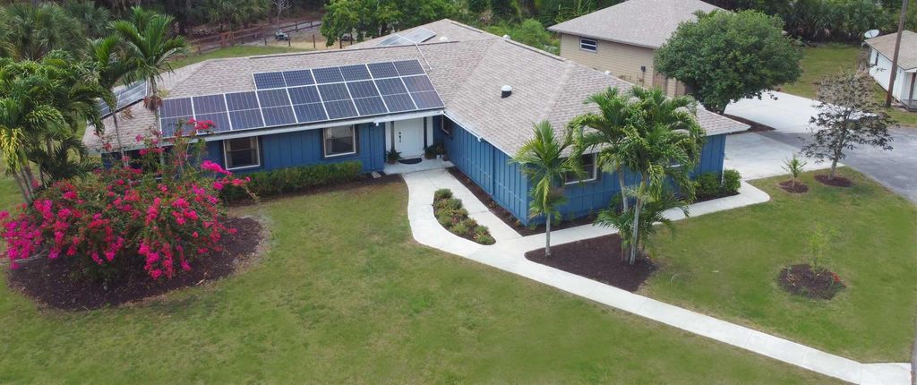 Photo of 4047 126th Drive N, West Palm Beach, FL 33411 (MLS # R10987011)