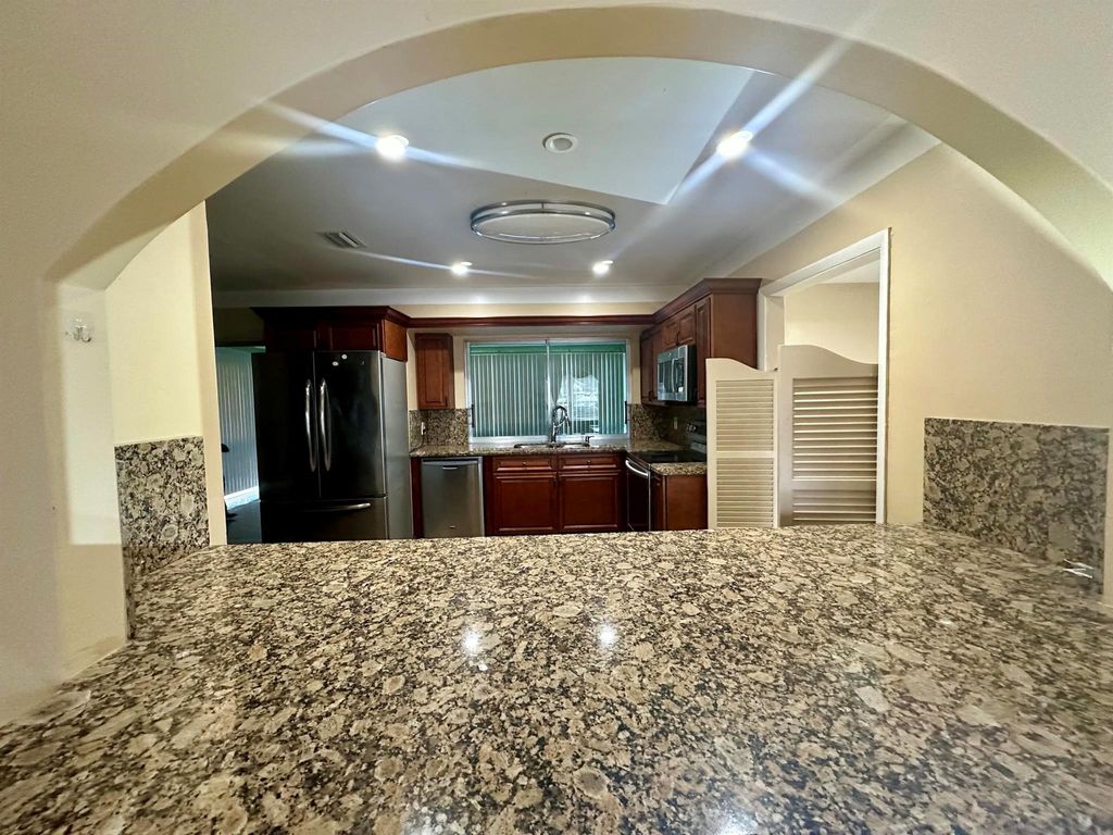 Photo of 1119 S Mangonia Circle, West Palm Beach, FL 33401 (MLS # R11047394)
