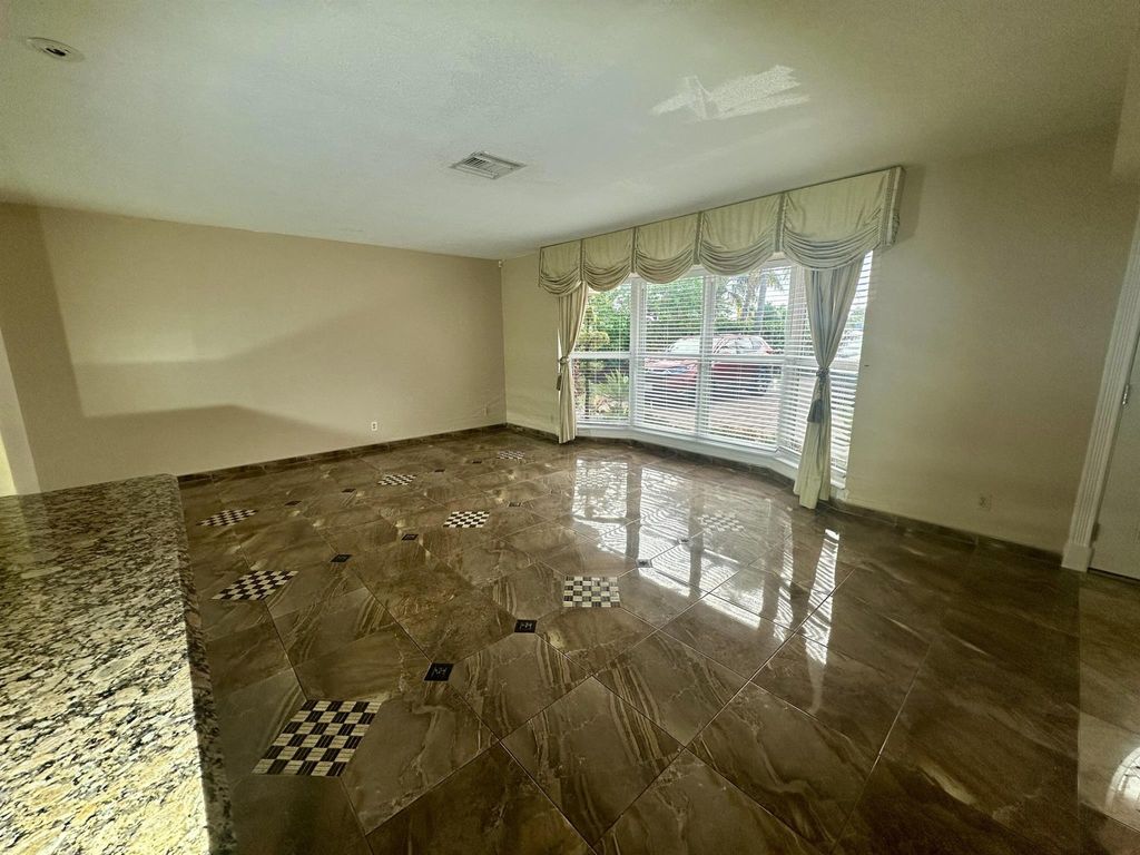 Photo of 1119 S Mangonia Circle, West Palm Beach, FL 33401 (MLS # R11047394)
