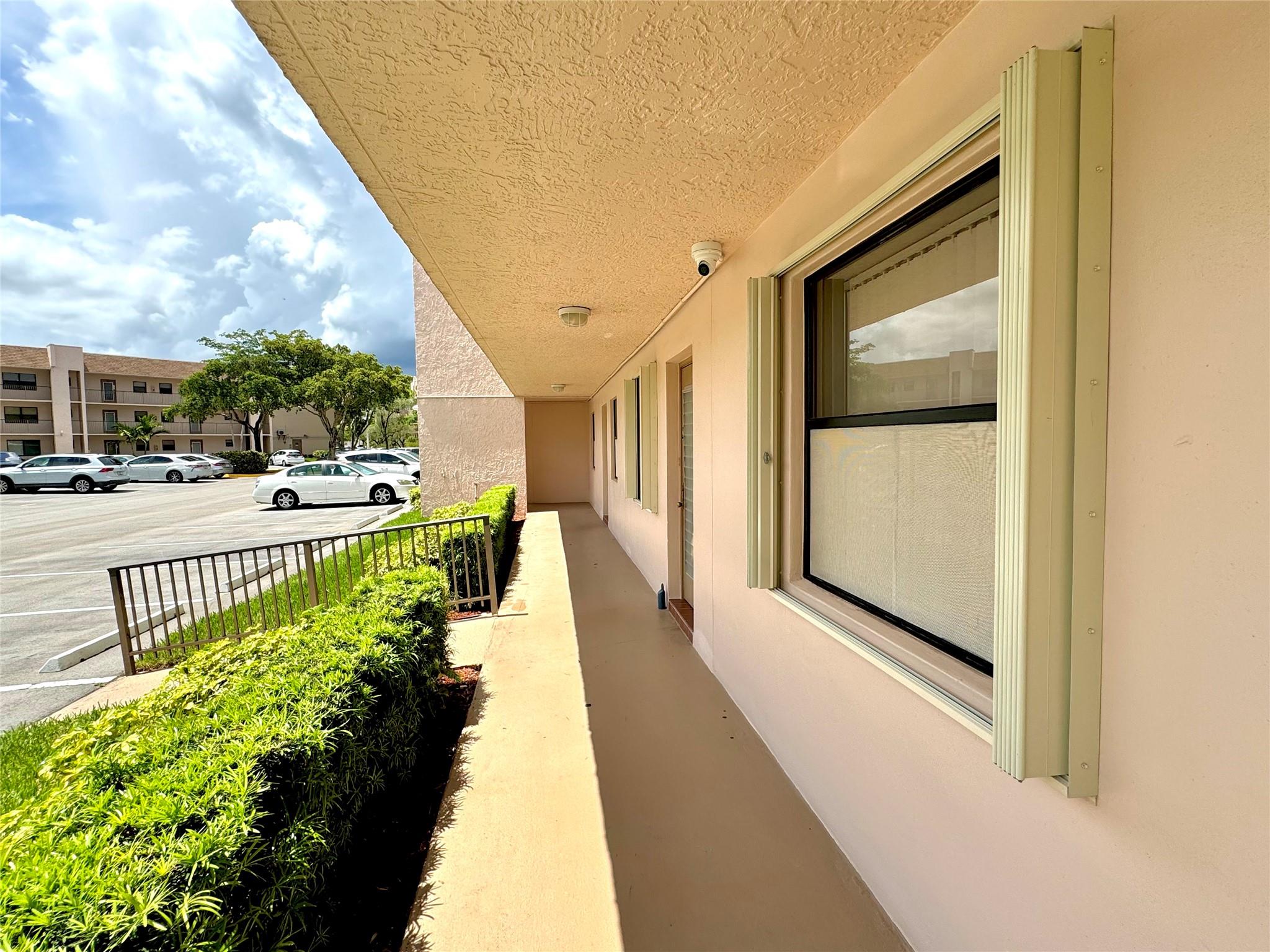 JUST REDUCED.....Spacious 2 bed, 2 bath 1st floor unit in the vibrant Sunrise lakes 55+community! Enjoy a beautiful golfcourse view right from your enclosed patio. Features include accordion shutters, an updated kitchen, in-unit washer and dryer, and laminate flooring throughout. Prime front-door parking adds ultimate convenience. Residents enjoy access to state-of-the-art clubhouses, multiple pools, fitness center, shows, and a full calendar of activities. Maint. includes water, cable, clubhouse access & more. 24/7 security & on-site management for peace of mind. – this unit is priced to sell. Don’t miss out on resort-style living in the heart of Sunrise!