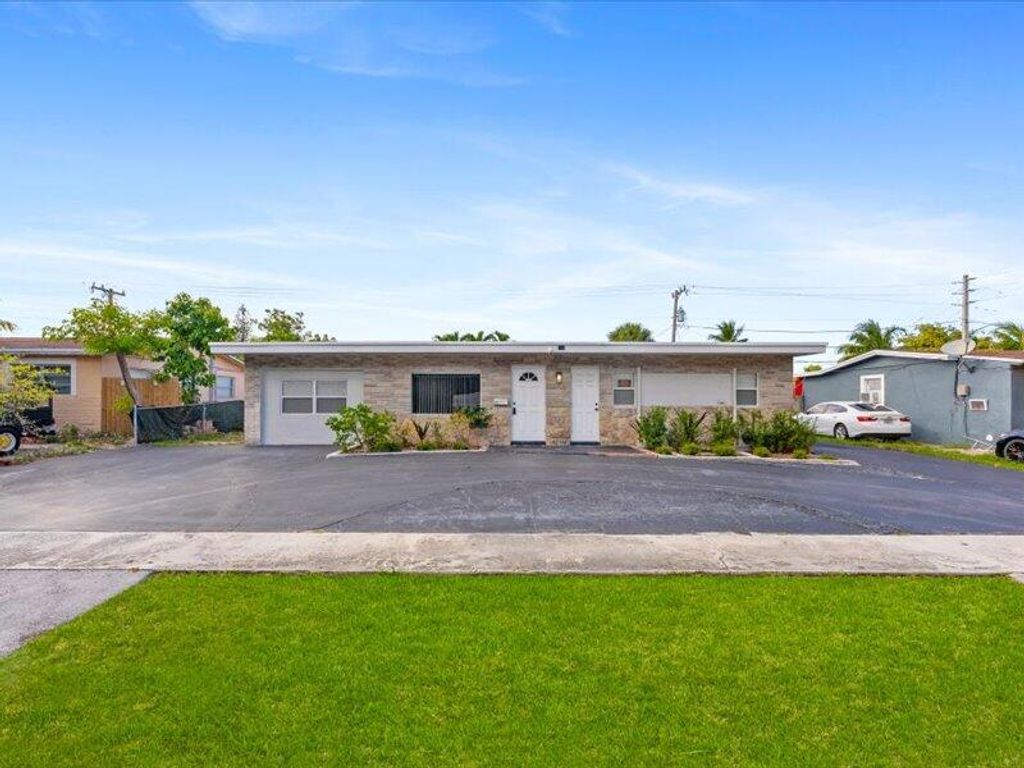 Photo of 311 W Sample Road, Deerfield Beach, FL 33064 (MLS # B26000171)