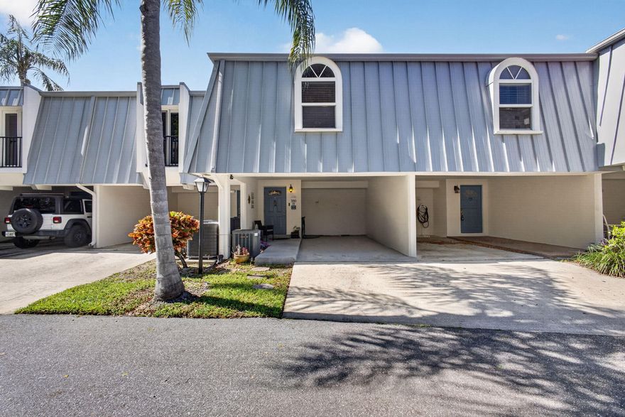 Welcome to the highly sought-after waterfront community of Royale Harbour! This townhome-style condominium offers an exceptional coastal lifestyle with a prime location and desirable amenities. Step inside to find new tile flooring throughout the living area, an updated kitchen featuring quartz countertops, premium wood cabinetry, stainless steel appliance package, and undermount sink. The residence has been thoughtfully modernized throughout and offers 3 bedrooms and 2 bathrooms, highlighted by an expansive primary suite with a private second-floor balcony overlooking the pool. Recent 2023 upgrades provide added peace of mind, including a metal roof and gutters, and hurricane impact windows. Enjoy front-row views of the Intracoastal Waterway during the Holiday Boat Parade and beyond.  Just steps from the community pool, tennis/pickleball courts, and day dock for convenient water access. Ideally situated in the exclusive Village of North Palm Beach, just minutes from both Jupiter Beach and Juno Beach, premier shopping at The Gardens Mall and Downtown at the Gardens, exceptional dining, and directly across the Intracoastal from North Palm Beach Country Club with championship golf and driving range. A rare opportunity to enjoy this premier lifestyle at an attractive price point.