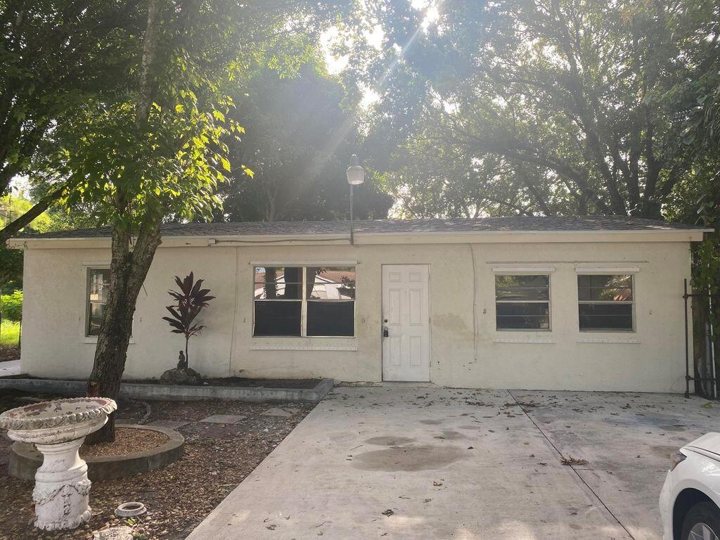 Explore this inviting 3-bedroom, 1-bathroom home with a spacious front and backyard for family and friends. Inside, discover a large laundry room with extra storage, and enjoy the freshly painted interior. Water is included in the rent, and the property features a well water and septic system, with treatment costs covered by the owner. Experience comfort and convenience in this well-maintained residence.