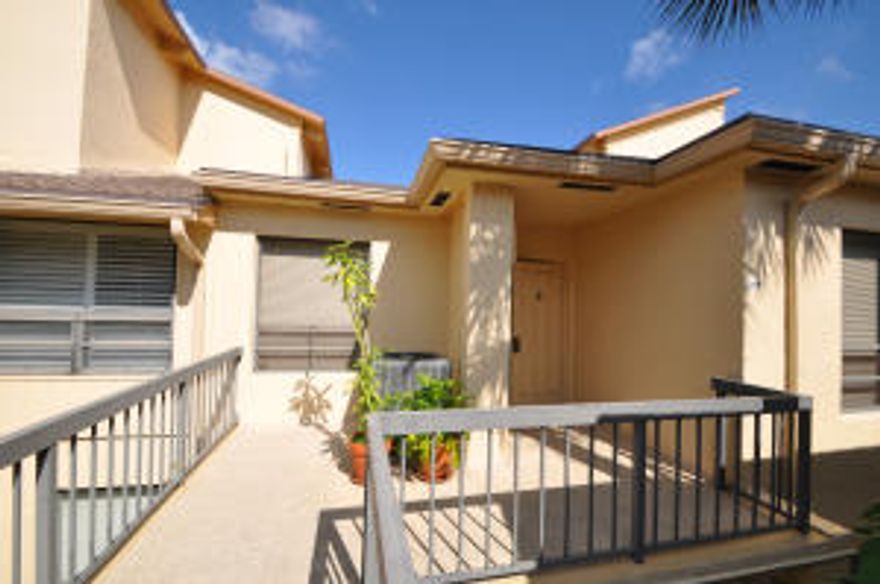 Lovely 2/2 condo boasts cathedral ceilings, eat in kitchen, great room and views of garden and pool.  2013 new air conditioning.