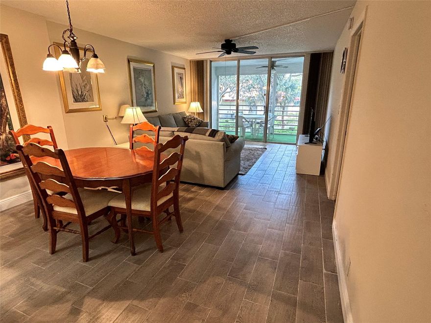 You will be impressed when you enter the community. It’s a wonderful place to live. Come and put your personal touch to this spacious 2/2 condo in a lovely 55+ community. A furnished, turnkey unit perfect if you are a snowbird or a full time Florida resident. New A/C installed Spring 2023, new wood-look tile floors; peaceful views of lush grounds.  Covered Screened Balcony feels like an extra Room! Enjoy the park-like community w/ heated pool, hot tub, BBQ picnic area, shuffleboard, club house with Billiards too. Maintenance includes internet and basic cable, pest control, water, exterior insurance, clubhouse & activities! (This building’s Association: $35,000 income, 680 credit, rental 3-12 months after 2 years ownership, and if financing 10% down in the executed contract when you apply.)