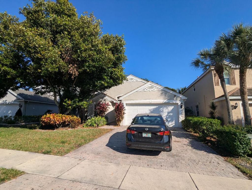 Photo of 114 Canterbury Place, Royal Palm Beach, FL 33414 (MLS # R11151008)