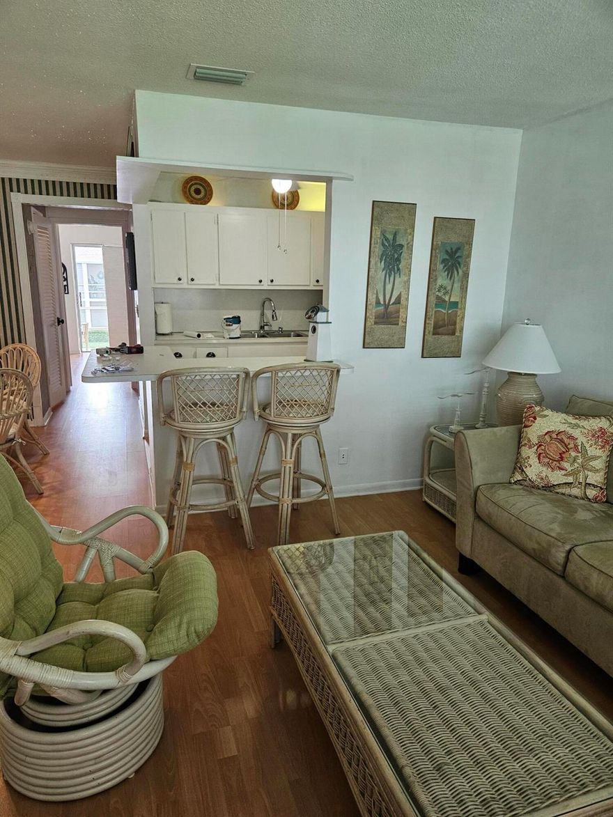 Experience relaxed coastal living in this light and bright condo nestled in a desirable intracoastal community. Enjoy a spacious screened-in patio--perfect for morning coffee or evening breezes. Community amenities include a sparkling pool, clubhouse, billiard room, fitness center, library, shuffleboard, and pickleball. HOPA verified, offering an active and friendly lifestyle with plenty of recreational options. Move-in ready and ideally located near the water--your perfect coastal retreat awaits!