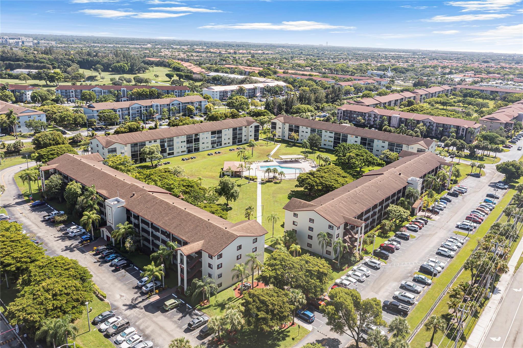 Come see this beautiful 55+ condo in Century Village. Features include 2 bedrooms, one and a half baths, located on the second floor. Brand new stainless steel appliances to be installed prior to closing. Porcelain tile throughout the unit, screened in patio, washer and dryer in the unit, newer ac. Plenty of amenities to enjoy including: a beautiful clubhouse, social clubs & events, 8 swimming pools resort-style, 2 fitness centers, 24-hour gated security, tennis courts, billiards, movie theater, live shows, complimentary bus transportation, pharmacy and café in the community, and golf course access. This unit is situated right next to one of the community pools. Priced to sell. Don't miss out on an amazing opportunity.
