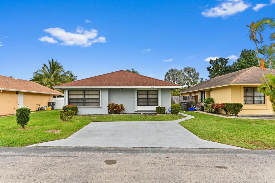 Welcome to Summit Pines! This charming 1-story home offers 1,456 sq ft of comfortable living space featuring 3 bedrooms and 2 bathrooms. This beautifully updated home featuring a fresh, modern interior and a light, airy feel throughout. From the moment you step inside, you'll notice the sleek tile flooring, recessed lighting, and contemporary color palette that create a clean and inviting atmosphere.   The stunning kitchen has been completely upgraded with white shaker cabinetry, stainless steel appliances, modern hardware, and stylish countertops, offering both functionality and a crisp, designer look. The layout flows seamlessly into the main living areas, making it perfect for everyday living and entertaining.  Enjoy spacious open-concept living and dining areas filled with natural light, plus sliding glass doors that lead to the backyard, blending indoor and outdoor living. Each bedroom offers comfortable space, great light, and the same modern finishes carried throughout the home.