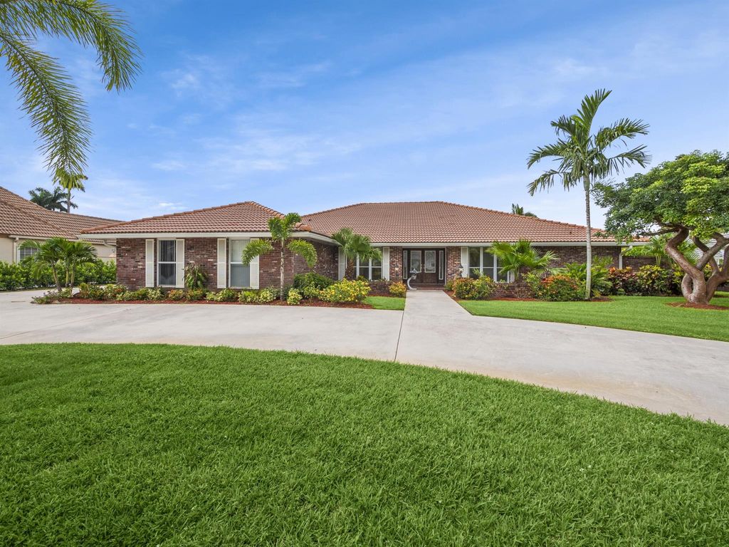 Photo of 469 Glenbrook Drive, Atlantis, FL 33462 (MLS # R10907268)