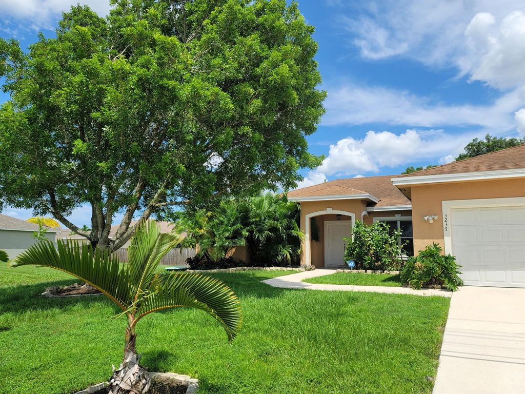 Photo of 3237 SW Rosser Boulevard, Port Saint Lucie, FL 34953 (MLS # R11013566)