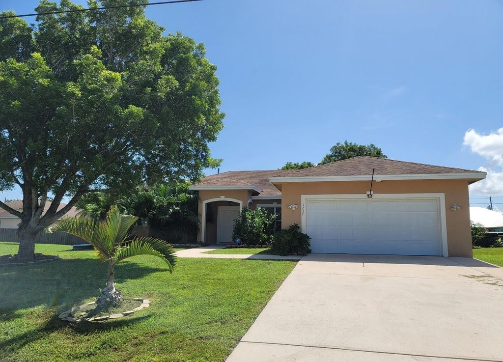 Photo of 3237 SW Rosser Boulevard, Port Saint Lucie, FL 34953 (MLS # R11013566)