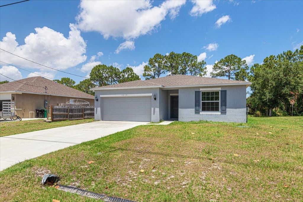 Photo of 1919 SW Fears Avenue, Port Saint Lucie, FL 34953 (MLS # R10985433)