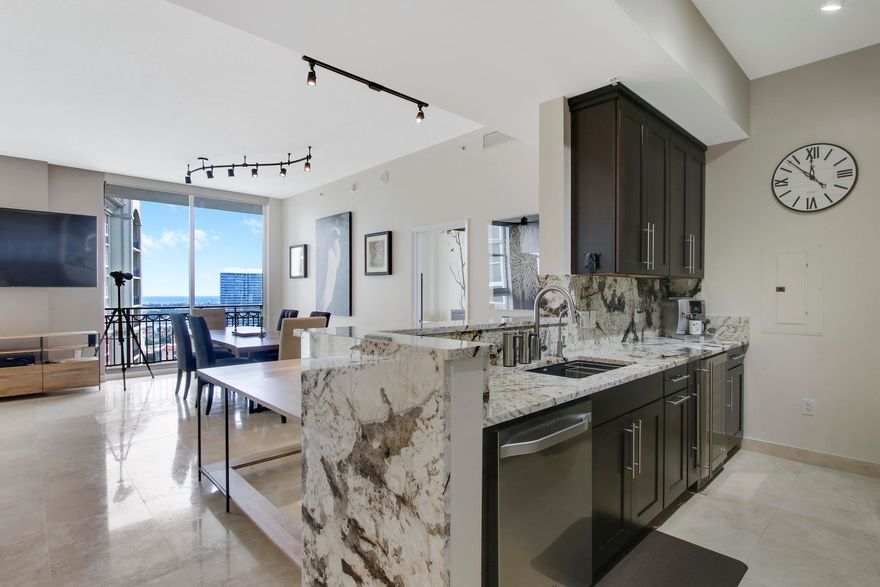 Downtown living at it's FINEST! Enjoy panoramic intracoastal/city views from the oversized balcony. Inside the residence you will find that every detail has been met in this sunny and open floor plan! The solid wood kitchen cabinetry, granite counter tops, top of the line appliances (including wine cooler) and air conditioning have all been replaced in the last couple of years and no expense was spared, two tandem parking spaces and extra storage. Residents at CityPlace South Tower can enjoy 24 hour security, full service valet, community/billiards room, swimming pool with grills, fitness center and onsite management and just steps from the building you're in the heart of everything.