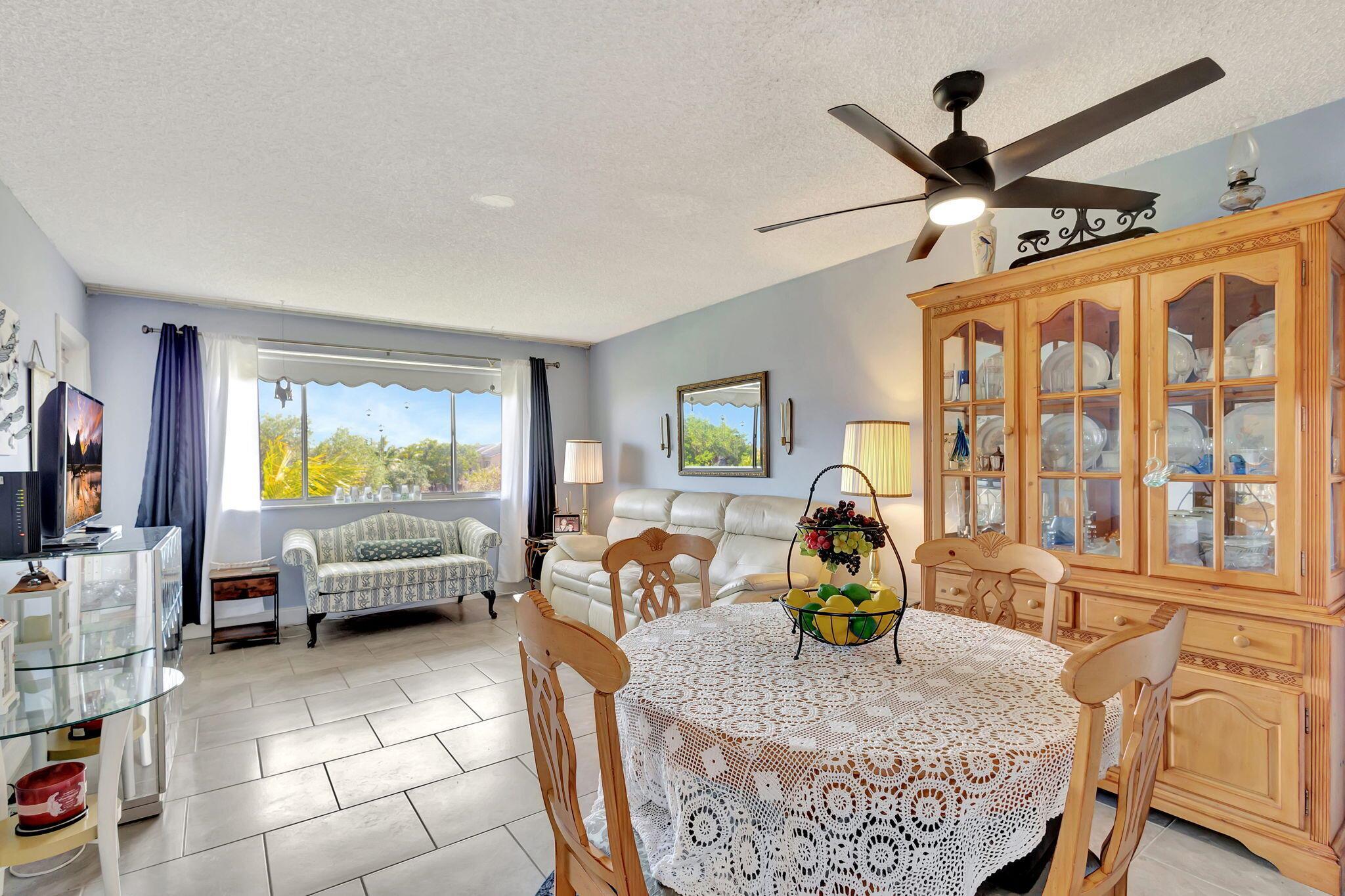 A brand-new bathroom, consistent flooring & water view distinguish this unit at Lake Clarke Gardens. An LED-framed mirror & new lighting fixtures modernize the floor plan. Access the balcony from both the bedroom & living room. The location along the perimeter of the community provides a serene canal view & quietude. Stainless-steel appliances in the kitchen. This unit has full storm protection with accordion shutters & the electrical panel has been upgraded.Lake Clarke Gardens has 2 heated pools flanking a massive community lake. The amenities by the main pool include a community room, theater, putting green, shuffleboard & fitness center. Management is on site. There are courtesy buses. This is a very active community with 855 units. Great proximity to the water, as well as downtown